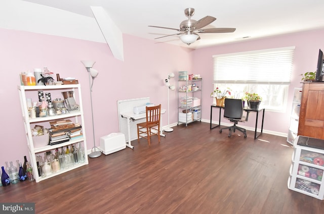 office space with a ceiling fan, visible vents, baseboards, and wood finished floors