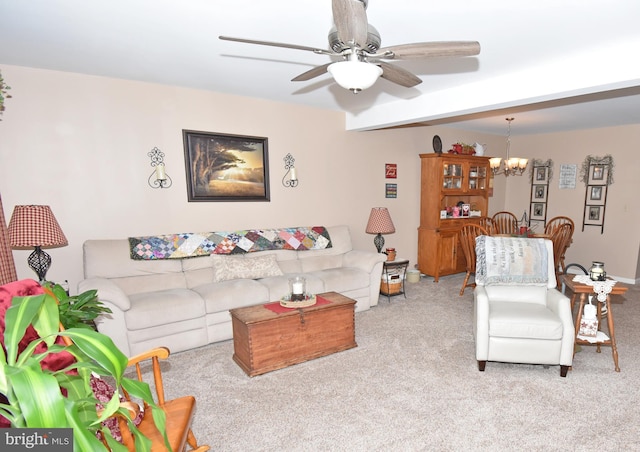 carpeted living room with ceiling fan with notable chandelier