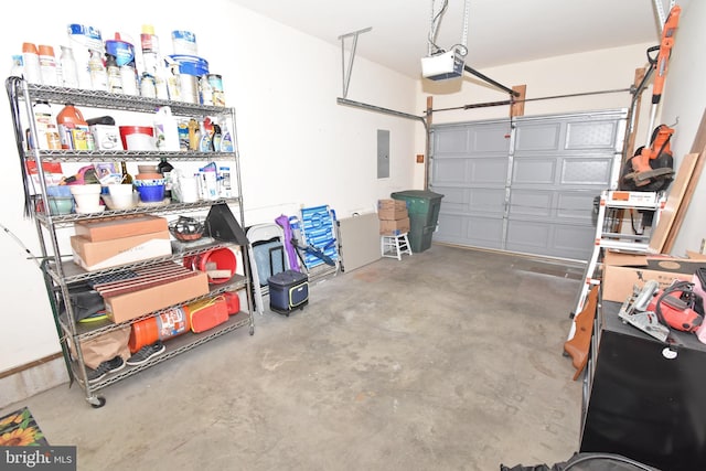 garage with electric panel and a garage door opener