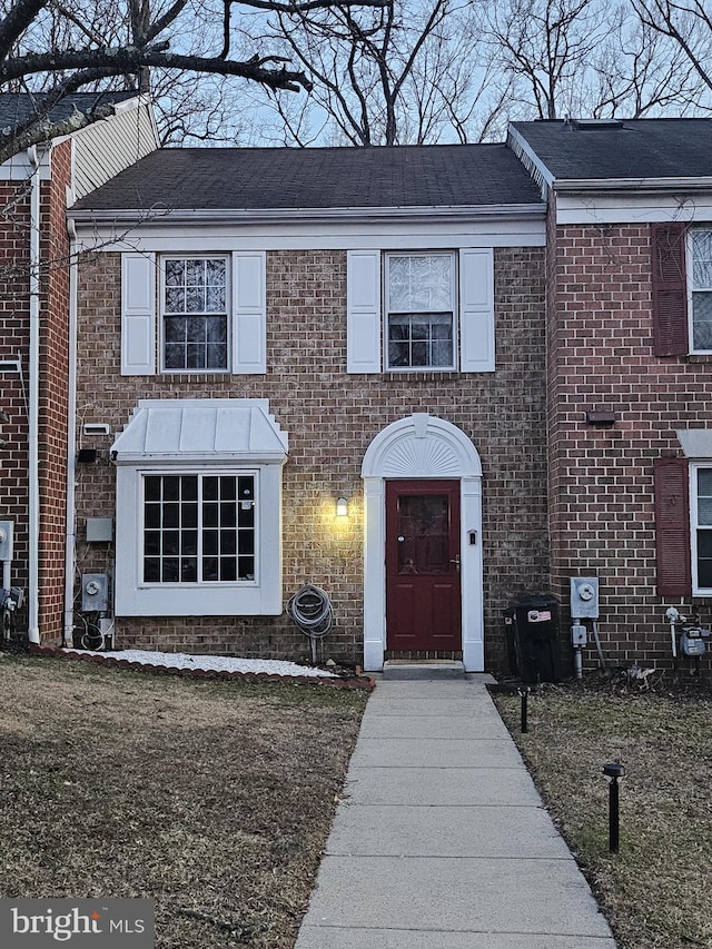 view of front of house featuring brick siding