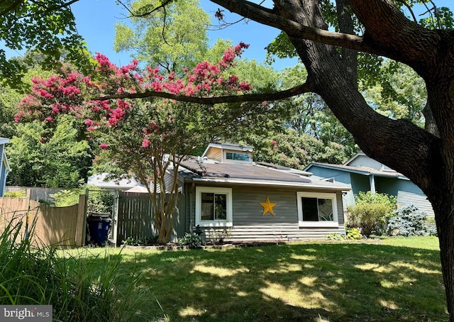 back of house with a yard