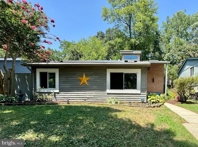 back of house featuring a yard