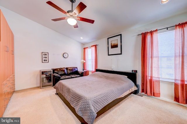 bedroom with recessed lighting, vaulted ceiling, a ceiling fan, and light colored carpet