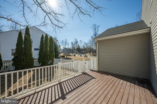 wooden terrace featuring fence