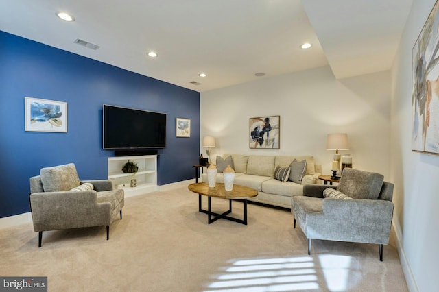 carpeted living room with baseboards, visible vents, and recessed lighting