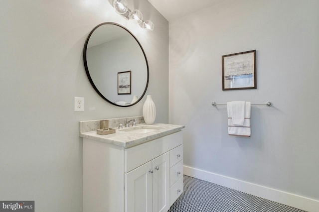 bathroom with vanity and baseboards