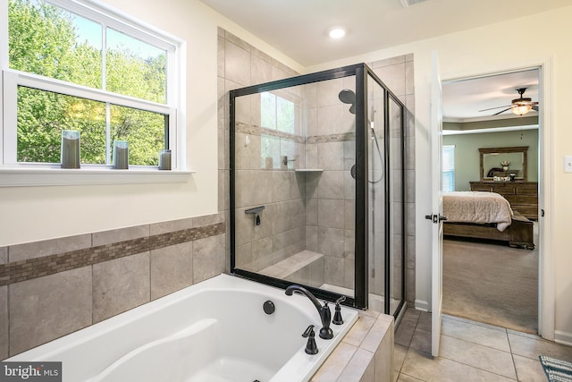 ensuite bathroom featuring a garden tub, a stall shower, connected bathroom, and plenty of natural light