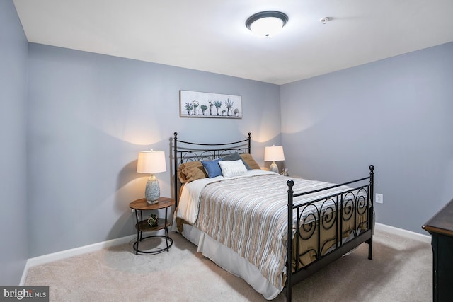 carpeted bedroom with baseboards