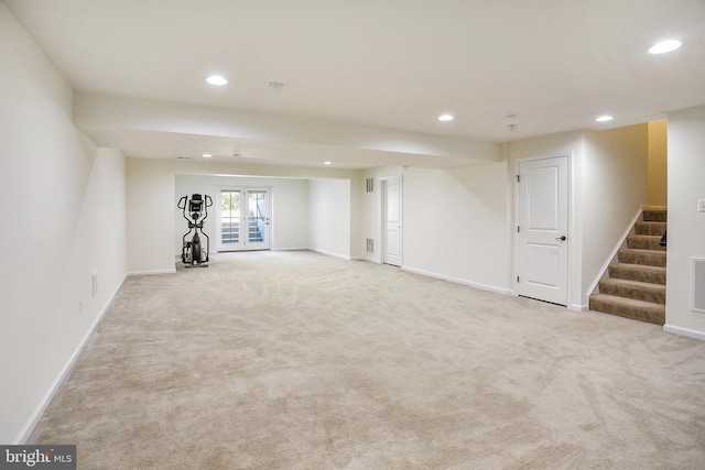 below grade area featuring recessed lighting, carpet floors, and stairway