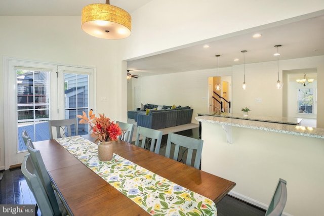 dining area with dark wood finished floors, stairway, a chandelier, and recessed lighting