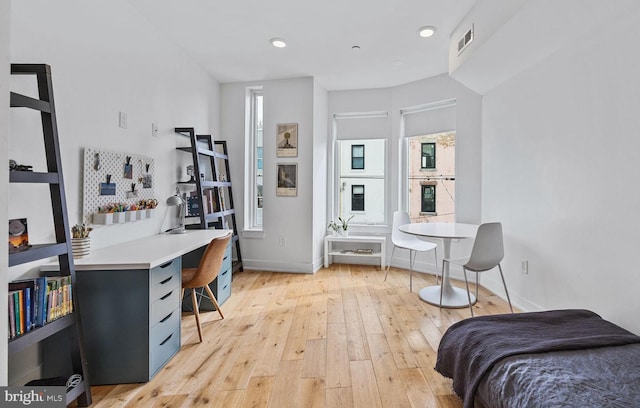 bedroom with light wood-type flooring