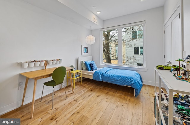 bedroom with light hardwood / wood-style flooring