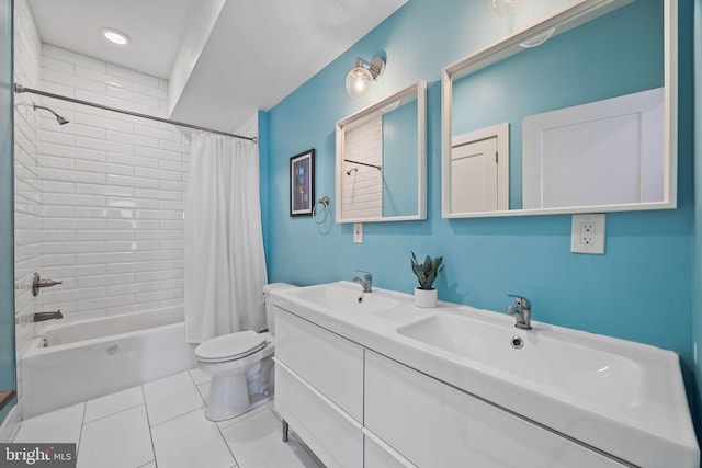 full bathroom featuring tile patterned floors, shower / bath combo with shower curtain, vanity, and toilet