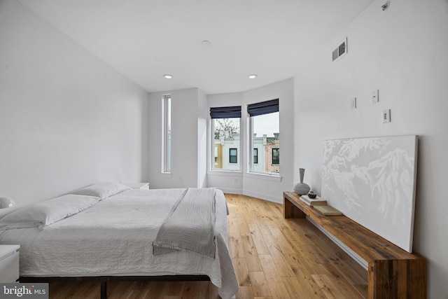 bedroom with light hardwood / wood-style floors