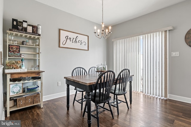 dining room with an inviting chandelier, dark wood-type flooring, and baseboards