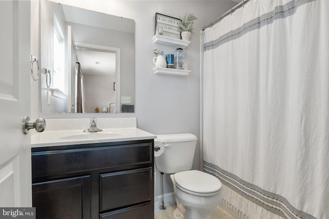 bathroom with toilet and vanity