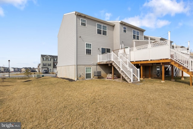 back of house featuring stairs, central AC unit, a lawn, and a wooden deck