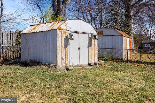 view of shed with fence