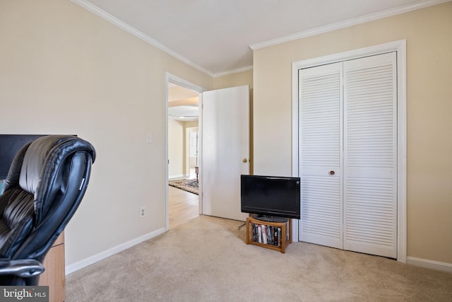 carpeted office space featuring baseboards and ornamental molding