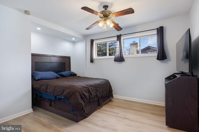 bedroom featuring recessed lighting, wood finished floors, baseboards, and ceiling fan