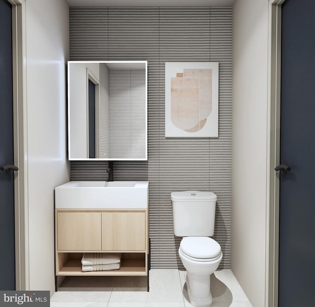 bathroom featuring toilet, tile patterned flooring, and vanity