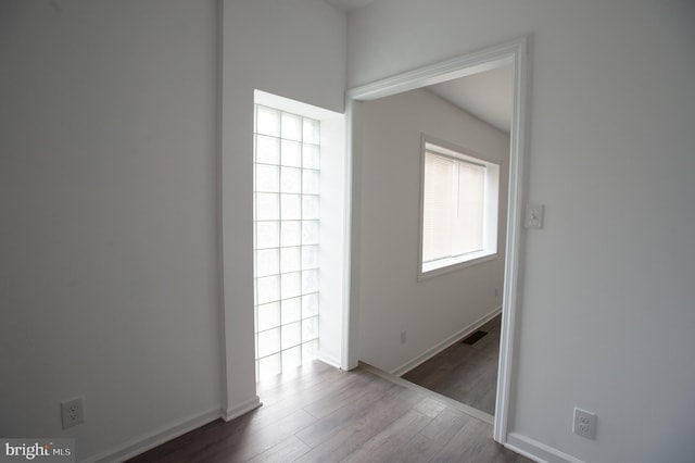 empty room with hardwood / wood-style flooring