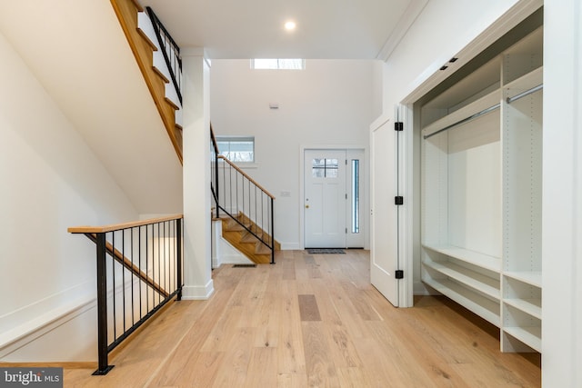 foyer entrance with light hardwood / wood-style flooring