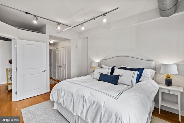 bedroom featuring a closet and wood finished floors