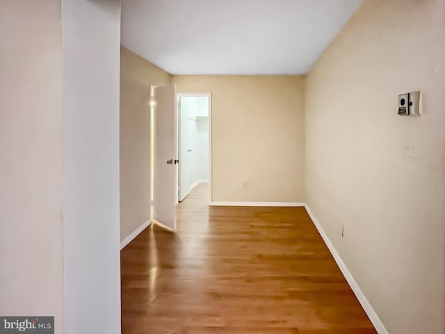 unfurnished room with hardwood / wood-style floors