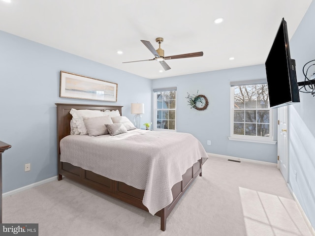 bedroom featuring light carpet, visible vents, baseboards, and recessed lighting