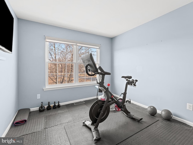 exercise area with visible vents and baseboards