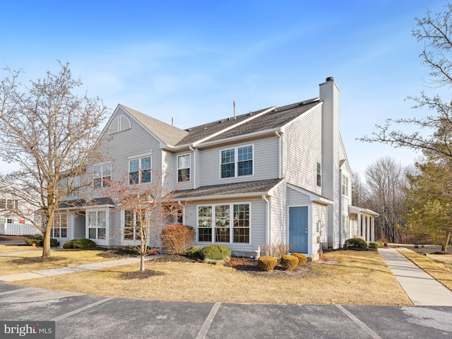 view of front of home featuring a chimney