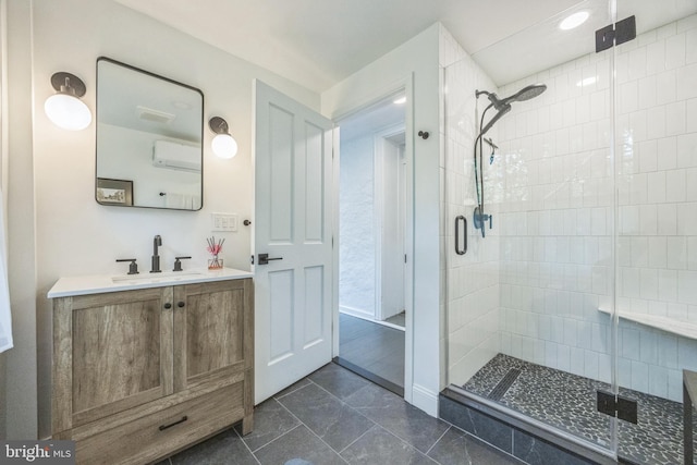 bathroom featuring a shower stall, a wall mounted air conditioner, and vanity