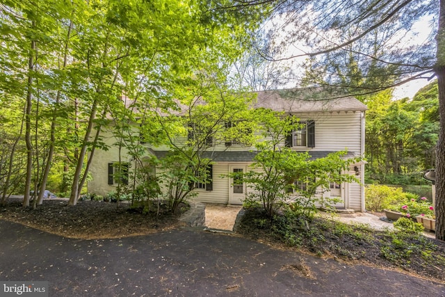 view of front of home with a shingled roof
