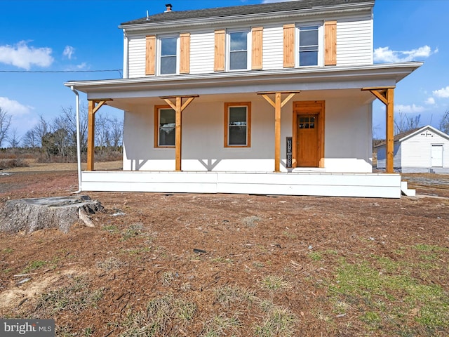 country-style home featuring covered porch