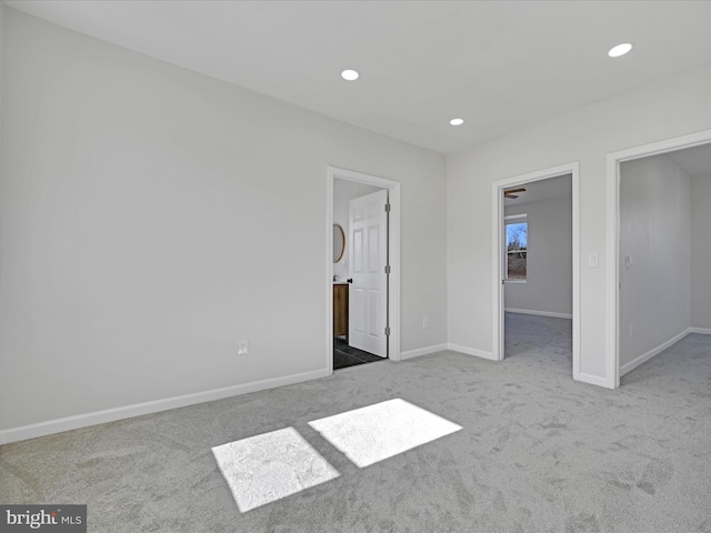 unfurnished bedroom featuring carpet floors and a spacious closet