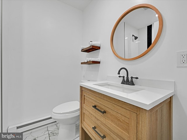 bathroom with toilet, vanity, and a baseboard radiator