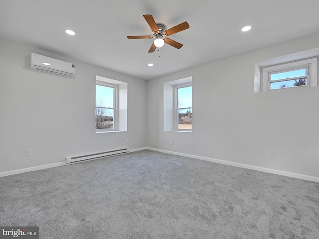 unfurnished room with an AC wall unit, a wealth of natural light, carpet flooring, and a baseboard radiator