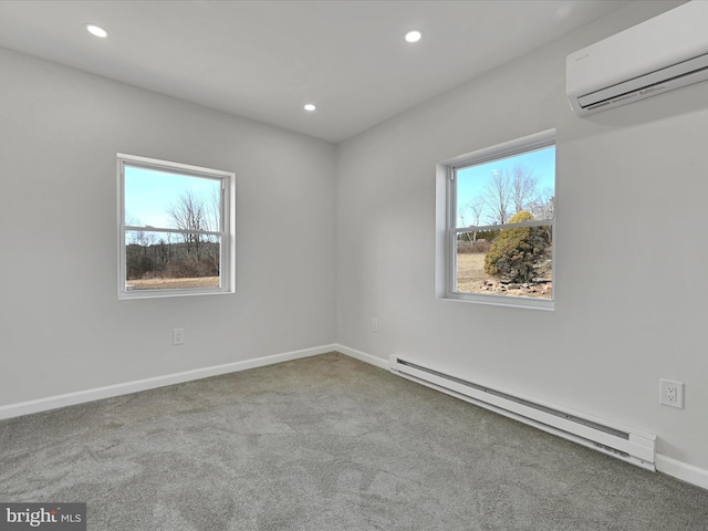 spare room featuring a baseboard radiator, a wall mounted air conditioner, light colored carpet, and plenty of natural light