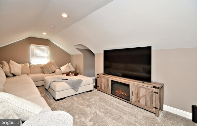 carpeted living area featuring lofted ceiling, baseboards, and recessed lighting