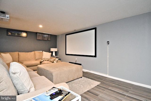 home theater featuring wood tiled floor, baseboards, and recessed lighting