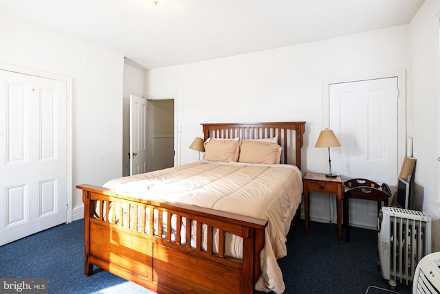 bedroom featuring dark colored carpet