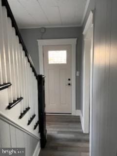 437 Willis St, Cambridge, MD 21613 - entrance foyer with a wainscoted wall, wood finished floors, stairs, and crown molding