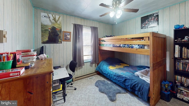 bedroom with a ceiling fan, light carpet, and baseboard heating