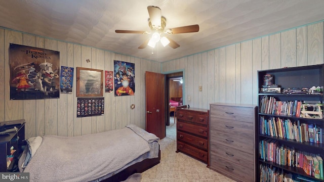 bedroom featuring a ceiling fan and light colored carpet