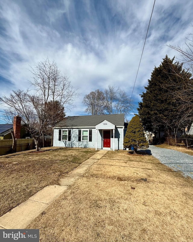 view of front of house featuring a front yard and fence