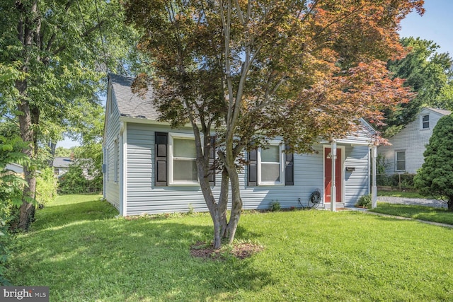 2715 Terrapin Rd, Silver Spring, MD 20906 - view of property hidden behind natural elements with a front yard and roof with shingles