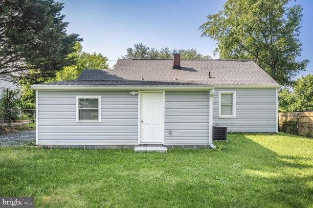 2715 Terrapin Rd, Silver Spring, MD 20906 - rear view of house with cooling unit, a chimney, and roof with shingles