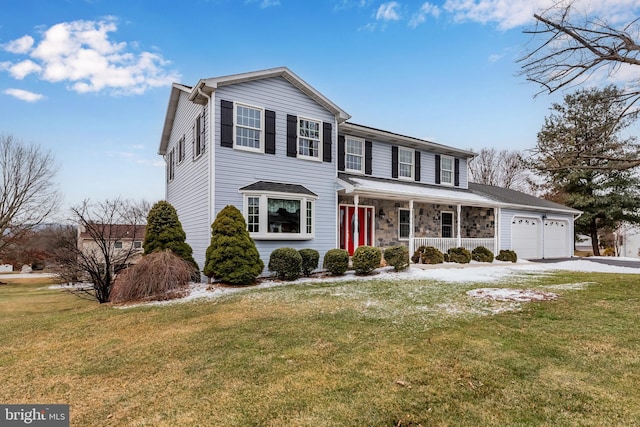 traditional home with a front yard, stone siding, covered porch, and an attached garage