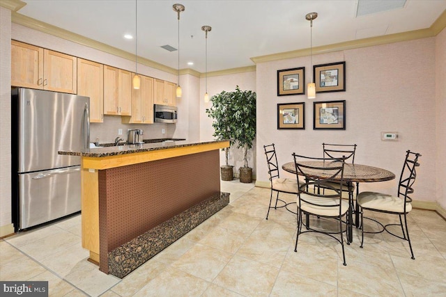 kitchen with stainless steel appliances, pendant lighting, visible vents, and light brown cabinets